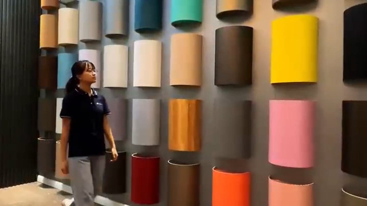 George Group team member reviewing material samples in a showroom.