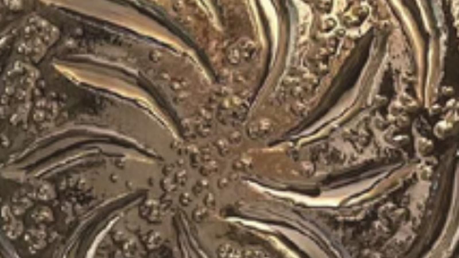 Close view of textured decorative glass catching warm light