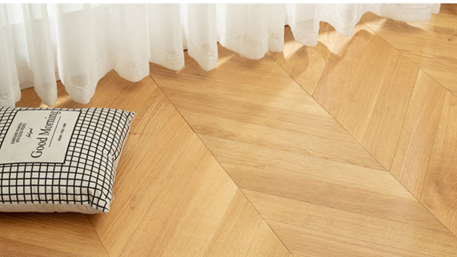Fishbone and herringbone engineered wood flooring scene with a light natural timber finish.