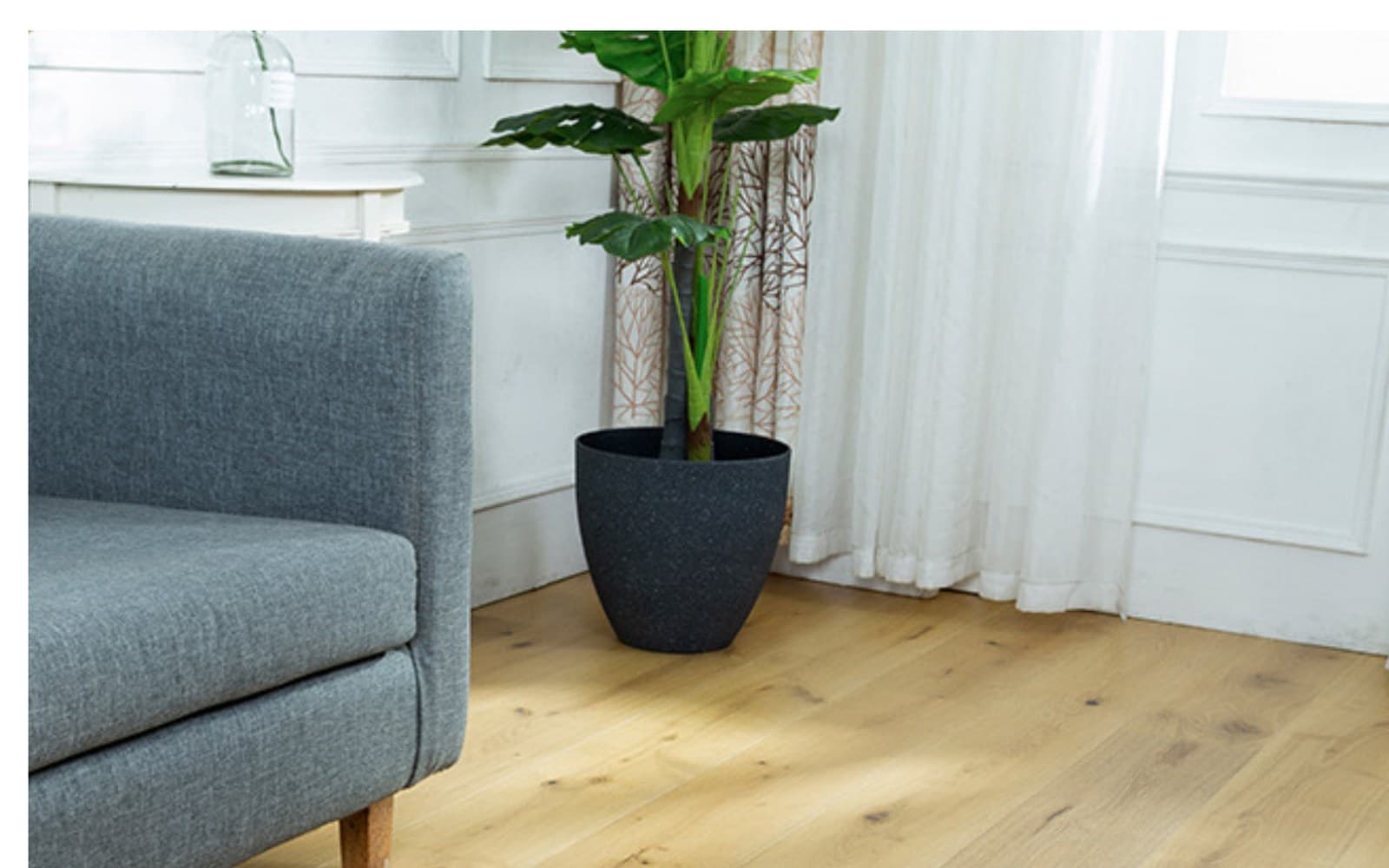 Wide engineered wood plank flooring scene in a bright interior.