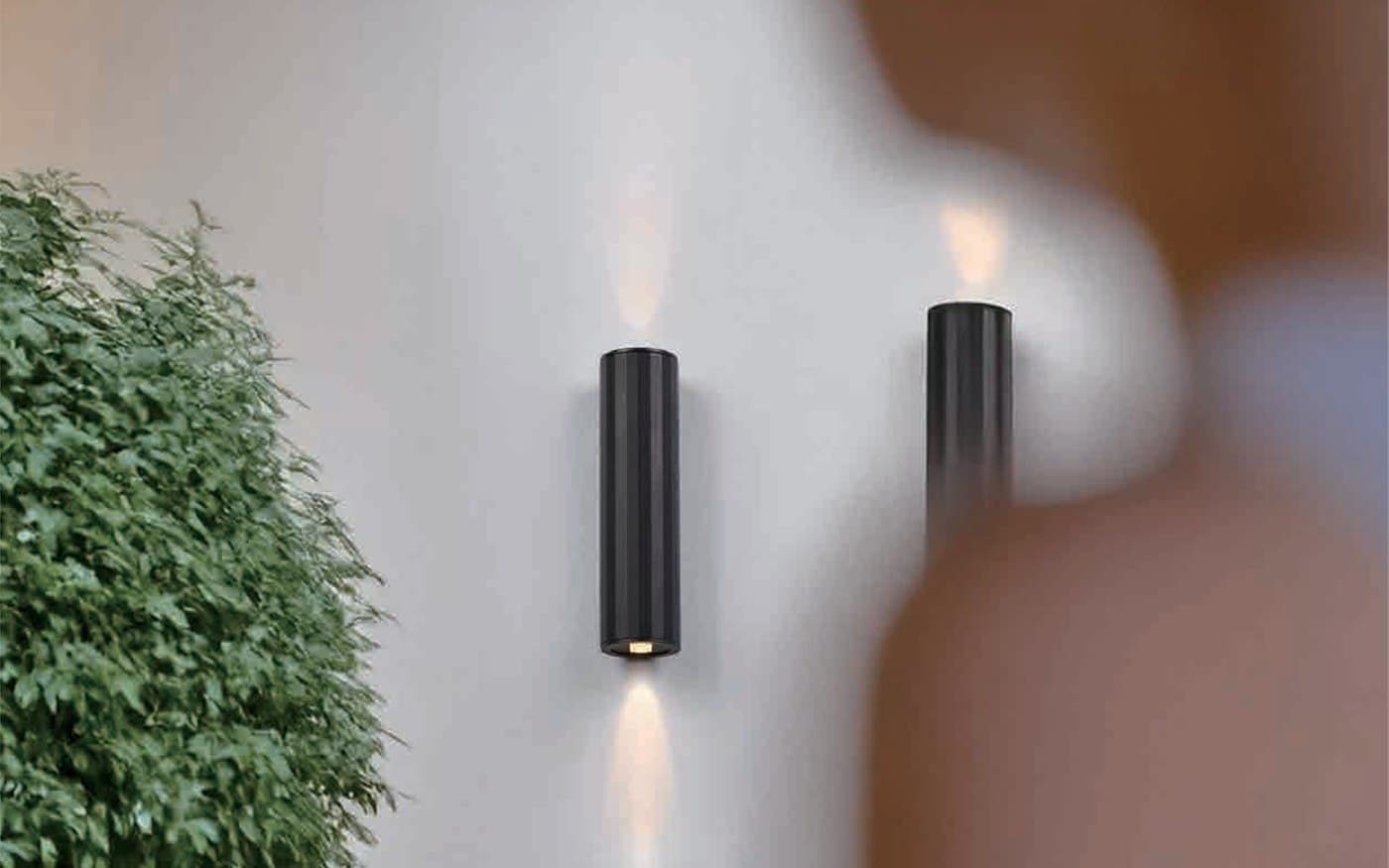 Outdoor wall lights creating upward and downward facade lighting effects.