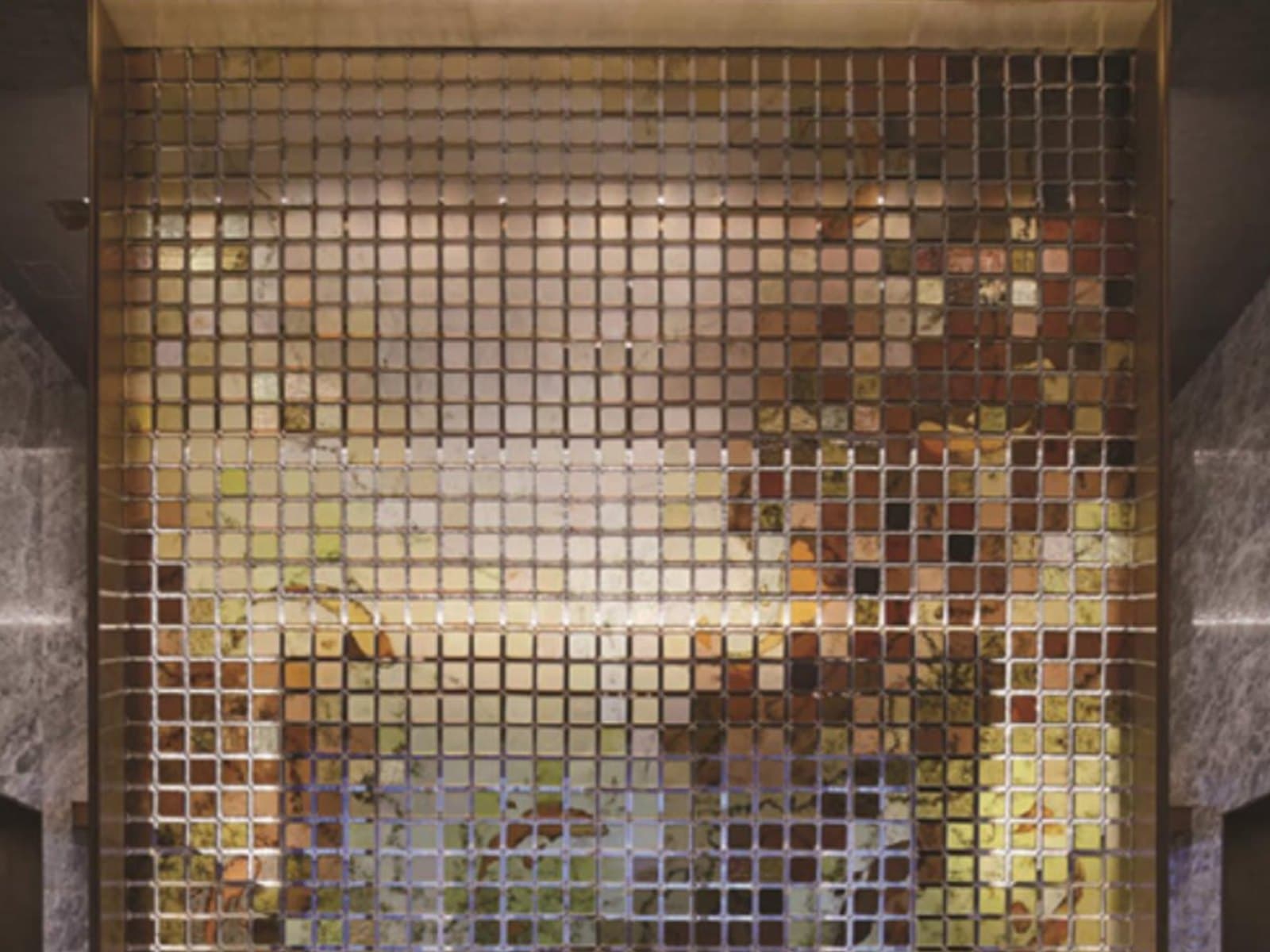 Architectural metal and glass screen reference for interior material review.